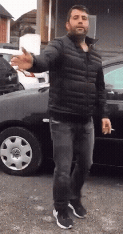 Man In Black Jacket Smoking Cigarette GIF