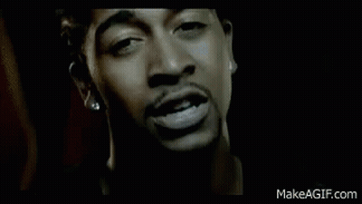 Man In Black Jacket Standing In Dark Room GIF