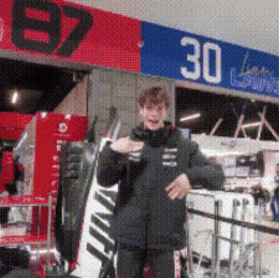 Man In Black Jacket Standing In Front Of 30 Sign GIF