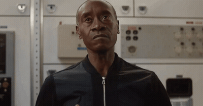Man In Black Jacket Standing In Front Of Wall With Buttons GIF