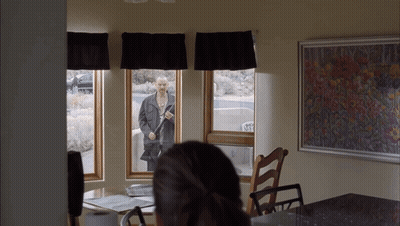 Man In Black Jacket Standing In Window GIF