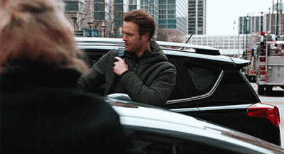 Man In Black Jacket Standing Next To Black Car GIF