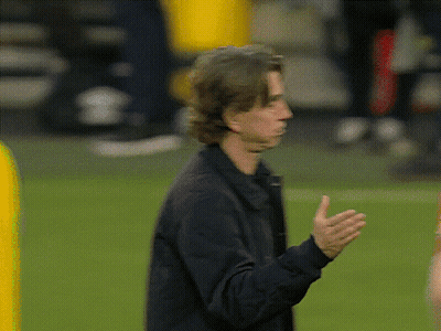 Man In Black Jacket Standing On Field GIF