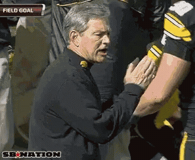 Man In Black Jacket Talking To Football Player Field Goal GIF