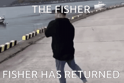 Man in Black Jacket Walking Along Dock The Fisher Has Returned