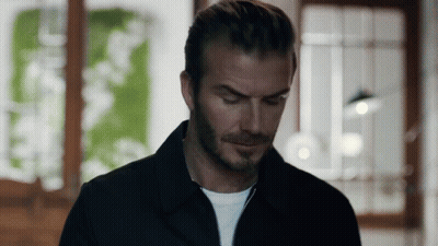 Man In Black Jacket White Shirt Looking Down GIF
