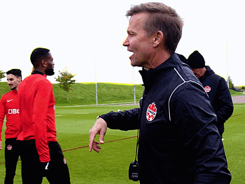 Man In Black Jacket With Canada Logo GIF