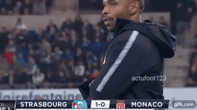 Man In Black Jacket With Monaco 1-0 Scoreboard GIF