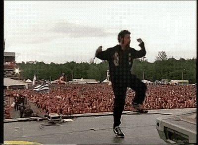 Man In Black Jacket With Number 8 Dancing On Stage GIF