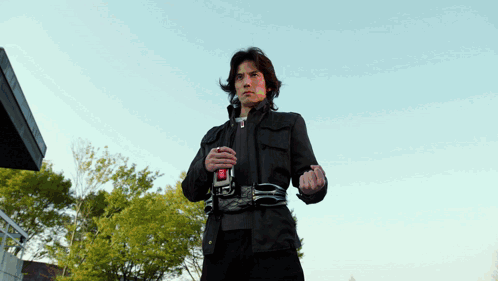 Man In Black Jacket With Red Button R GIF