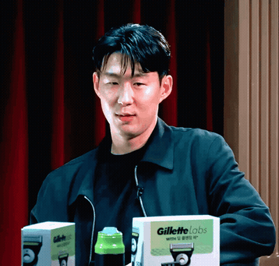 Man In Black Jacket With Two Gillette Razor Boxes GIF
