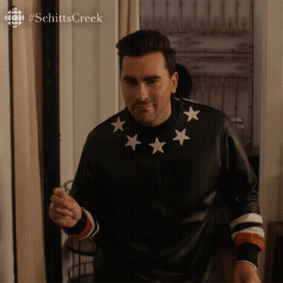 Man in Black Jacket With White Stars Pointing