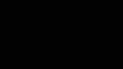 Man In Black Jacket With Wings Standing Before Flaming Screen GIF