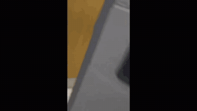Man In Black Jumpsuit At Sink GIF
