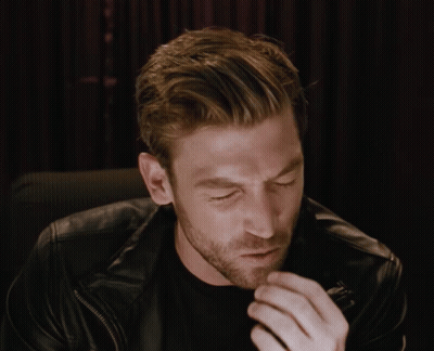 Man In Black Leather Jacket Making Funny Face GIF