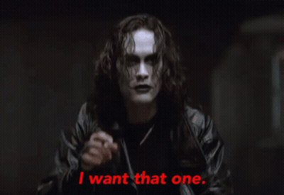 Man in Black Leather Jacket Points Saying I Want That One