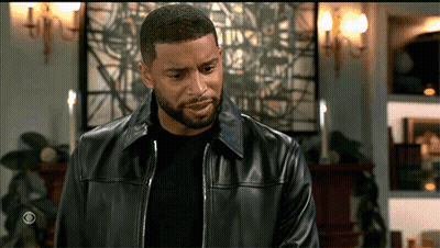 Man In Black Leather Jacket Standing In Living Room GIF