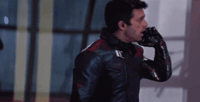 Man In Black Leather Jacket Talking On Cell Phone GIF