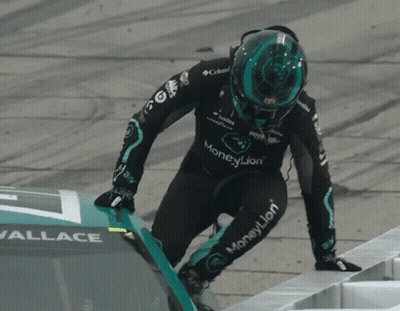 Man In Black Logitech Shirt Talking To Two Men GIF