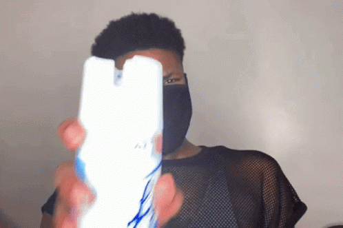 Man In Black Mask Holding Air Freshener GIF