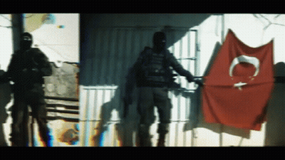 Man In Black Mask With Red Flag Letter C GIF