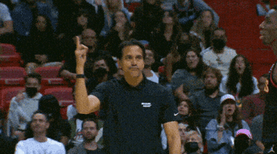 Man In Black Miami Shirt Before Crowd GIF