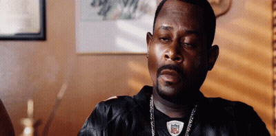 Man In Black NFL Jersey Sitting In Chair GIF
