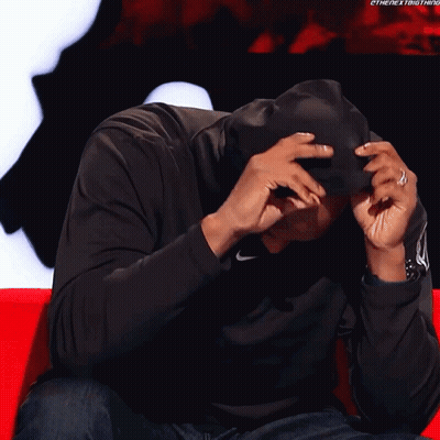 Man In Black Nike Hoodie Covering Face GIF