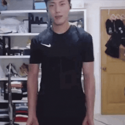 Man In Black Nike Shirt Standing GIF