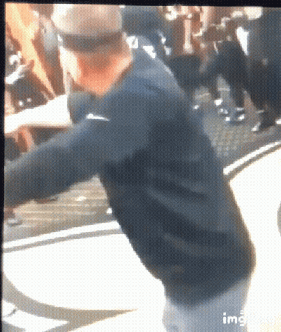 Man In Black Nike Shirt Standing Before Crowd GIF