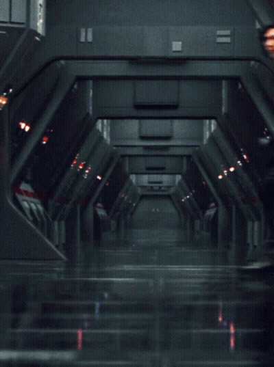 Man In Black Outfit Standing In Hallway GIF