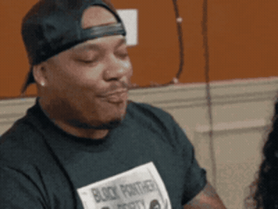 Man In Black Panther Shirt Making A Face GIF
