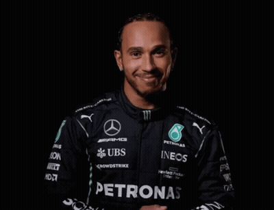 Man In Black Petronas Jacket Smiling GIF