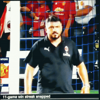 Man In Black Puma Shirt In Front Of Net GIF