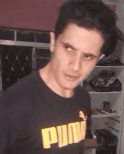 Man In Black Puma Shirt Making Face GIF