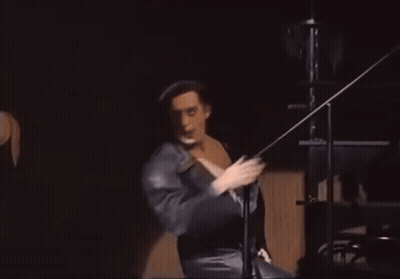 Man In Black Robe Dancing On Stage GIF