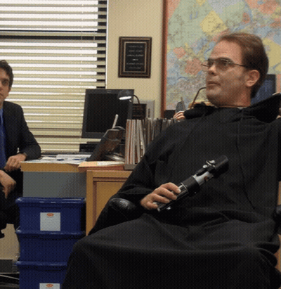Man In Black Robe Holding Light Saber GIF