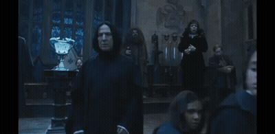 Man In Black Robe In Dark Room GIF