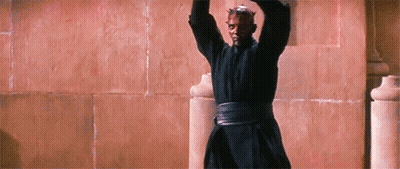 Man In Black Robe Standing With Arms Up GIF