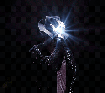Man In Black Sequined Jacket And White Hat Holding Light GIF
