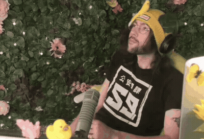 Man In Black Shirt 59 At Microphone GIF