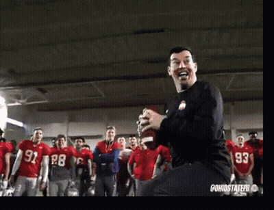 Man In Black Shirt 93 Dancing In Front Of Football Players GIF