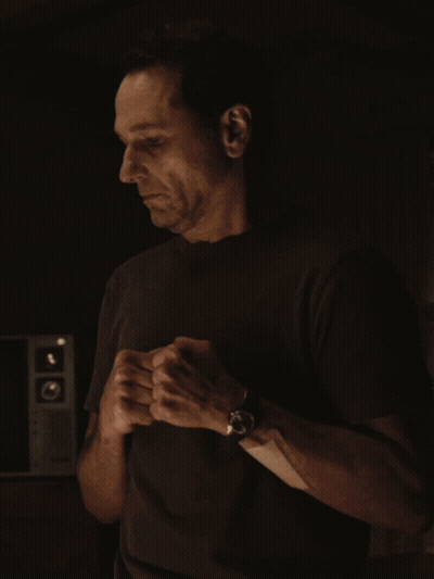 Man in Black Shirt Adjusting Wristwatch