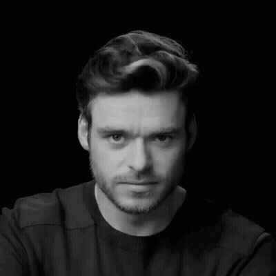 Man In Black Shirt And Beard Looking Down GIF