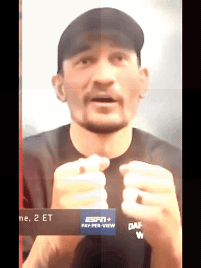 Man In Black Shirt And Black Hat Saying Pay Per View GIF