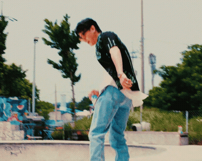 Man In Black Shirt And Blue Jeans In Front Of Pepsi Sign GIF