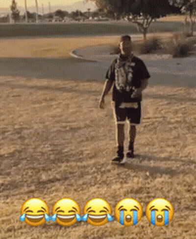 Man In Black Shirt And Blue Shorts In Field Of Smileys GIF