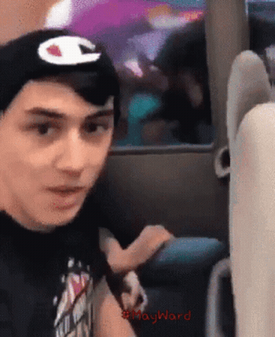 Man In Black Shirt And Hat With Champion Logo GIF