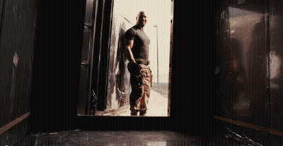 Man In Black Shirt And Khaki Pants In Dark Room GIF
