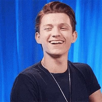 Man In Black Shirt And Necklace Smiling GIF